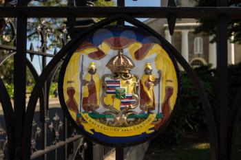 Painted Hawaiian royal seal on the cast iron fencing and gates at Kawaiahao Church in downtown Honolulu, Oahu, Hawaii
