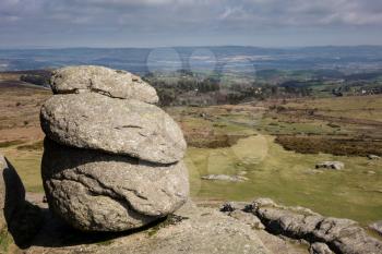 Haytor or Hay Tor rocks with single granite rock framing the view over Dartmoor, Devon, England, United Kingdom