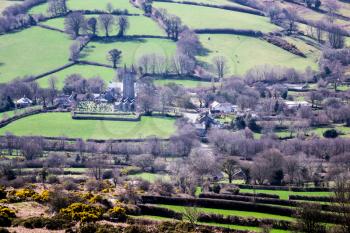 View of village of Widecombe in the Moor from the moorland overlooking the village on Dartmoor, Devon, England, UK