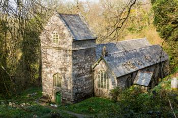 Ancient norman parish church in woodland in Minster, Boscastle, Cornwall, England, UK