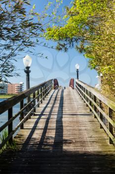Wooden pathway across pedestrian bridge to island off Ocean City, Maryland, USA