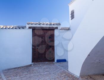 White courtyard of cave house above Campo de Criptana in Castilla-La Mancha, Spain
