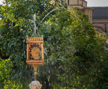 Unusual fountain in gardens of Mosque and Cathedral of our Lady of the Assumption in Cordoba, Andalucia, Spain