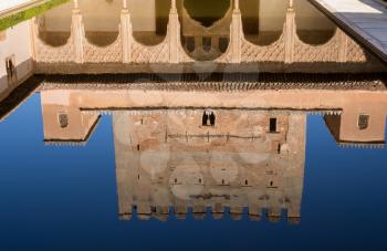 Courtyard and reflecting pool in Palacios Nazaries in Alhambra palace in ancient city of Granada in Andalucia, Spain, Europe