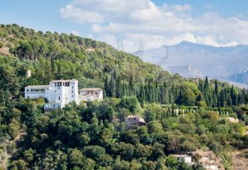 View of Generalife Palace and Garden in Alhambra from Mirador San Nicolas in ancient city of Granada in Andalucia, Spain, Europe