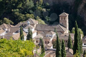 View of St Peter and St Paul church from Mirador San Nicolas in ancient city of Granada in Andalucia, Spain, Europe