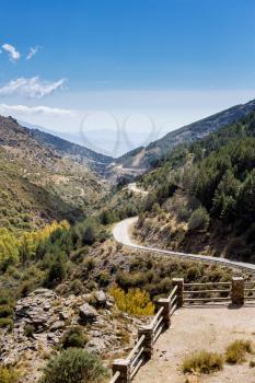 View down the winding A337 road from the Puerto de la Ragua mountain pass over the Sierra Nevada mountains in Andalucia, Spain