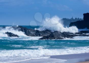 Dramatic powerful waves crash over rocks on dangerous beach at Lumaha'i, Kauai, Hawaii