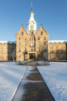 Entrance and clock tower of Trans-Allegheny Lunatic Asylum which is a Kirkbride Psychiatric hospital  in Weston, West Virginia, USA
