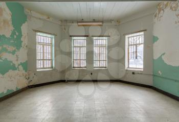 Empty room with windows inside Trans-Allegheny Lunatic Asylum in Weston, West Virginia, USA