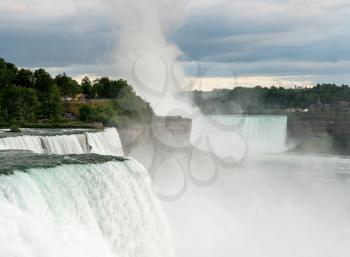 Canadian or Horseshoe waterfall in background with American Falls in foreground at Niagara