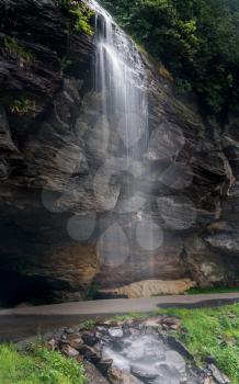 Bridal Veil Falls waterfall with blurred motion cascading down the rocks near Highlands on Mountain Water Scenic Byway in North Carolina, USA
