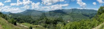 Roadside overlook in the mountains of Tennessee alongside interstate I26 with views of the tree covered mountains