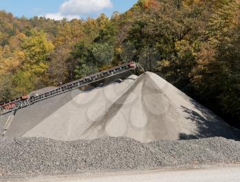 Limestone quarry and crushed stone processing plant in wooded valley in West Virginia serving local road construction needs