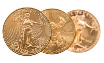 Trio of gold eagle one troy ounce golden coins from US Treasury mint