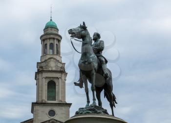 A statue of General George Henry Thomas by John Quincy Adams Ward was erected in Thomas Circle in Washington DC in 1879. National City Christian Church is behind on cloudy day