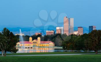 City skyline of Denver Colorado from the City Park taken from front of Science Museum just before sunrise with the fountain and Boathouse and Ferril Lake