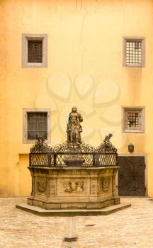Statue and fountain in courtyard of town hall in the medieval town of Regensburg, Bavaria, Germany