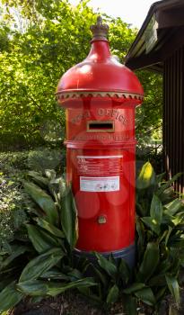 Round english style post office mail or pillar box in garden in Melbourne Australia