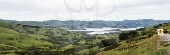 Panoramic view of the coastline around Akaroa harbour near Christchurch on South Island of New Zealand