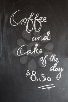 Coffee and cake of the day blackboard in cafe, coffee shop or restaurant