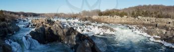 Panorama of Great Falls on Potomac river outside Washington DC in winter with ice forming on the cascades and snow on the rocks