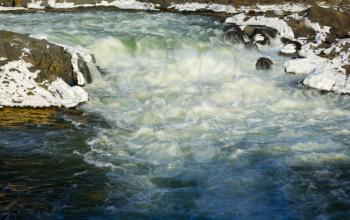 Great Falls on Potomac river outside Washington DC in winter with ice forming on the cascades and snow on the rocks