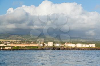 Large electricity generating station powered by diesel in tanks along coast at Port Allen Kauai