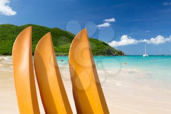 Anse Marcel beach with three yellow kayaks or canoes on french side of St Martin Sint Maarten Caribbean