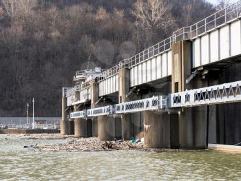 Lock or dam sluice gates on River Monongahela in Morgantown West Virginia with collected trash