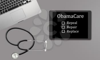 Healthcare concept with clean desk with medical and healthcare equipment with copyspace for message about Obamacare decision