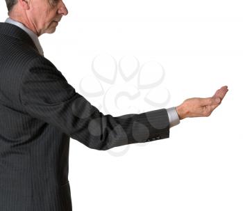 Senior caucasian businessman or executive isolated against white background. Subject is in profile and holding his hand out for money