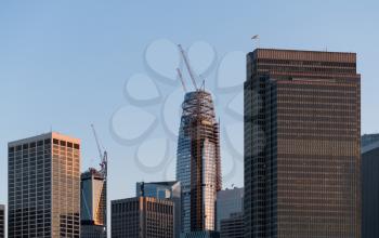 Skyline of downtown financial district of San Francisco in California. New construction of major tower blocks continues with cranes and scaffolding