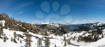 Truckee lake in snow covered Sierra Nevada mountains from Donner Pass and bridge