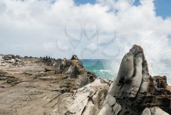 Coastline and rugged lava rocks called Dragons Teeth at Makaluapuna Point near Kapalua, Maui, HI, USA