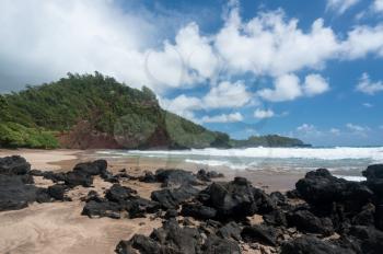 Waves break on Koki beach near Hana on Hawaiian island of Maui