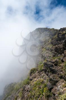 Clouds swirl over the Leleiwi overlook into the crater on Haleaka mountain in Maui