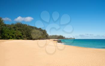 Golden sands with warm turquoise ocean off Lumahai Beach in Kauai in Hawaiian islands