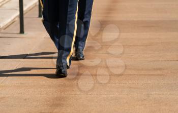 Detail of uniforms and legs of Honor Guard at tomb of unknowns in Arlington Cemetery