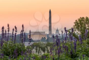 Dawn and sunrise over nations capital with all monuments aligned against orange sky