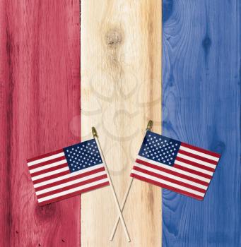 Timber planks of wood in the colors of a flag for USA with small flags for fourth of July celebration