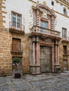 Ornate and solid wooden doors in city of Cadiz in Southern Spain