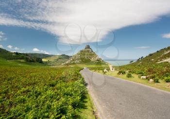 Road leading down to rock formation at Valley of the Rocks in North Devon, England