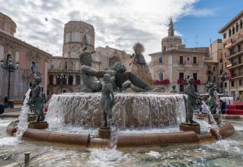 VALENCIA, SPAIN - MARCH 16, 2018: Neptune fountain in old city of Valencia during the Fallas Festival in March