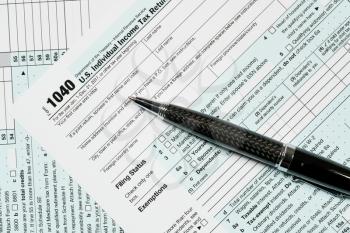 USA IRS tax form 1040 for year 2017 with pen and taken from above