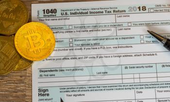 New Form 1040 Simplified for 2018 with bitcoin coins for reporting of gains from currency trading