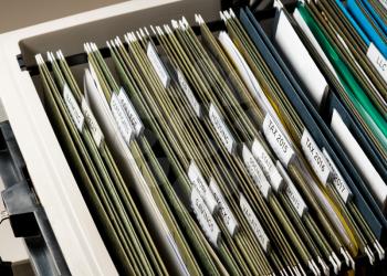 Close up of a well organized home filing system with tabs for each subject