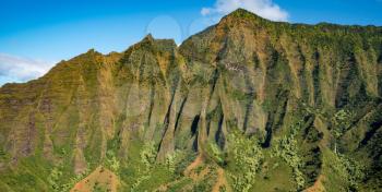 Aerial view of Na Pali mountains and Kalalau valley on hawaiian island of Kauai from helicopter flight