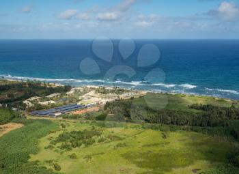 Aerial view of hotel and landscape of hawaiian island of Kauai from helicopter flight