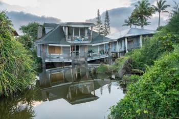 Two beach homes sinking into sink hole after the massive rain storms of April 2018 on Kauai